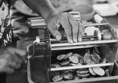 Midsection of man preparing food