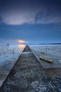 Scenic view of snow against sky during sunset