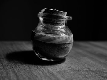 Close-up of glass of jar on table