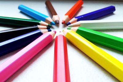 Close-up of colored pencils on table