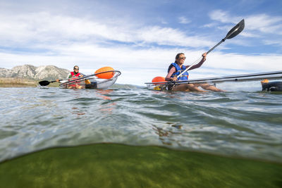 Kayakers enjoying a summer morning paddling on lake tahoe, ca