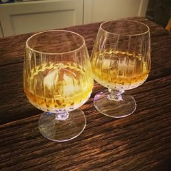 Close-up of wineglass on wooden table