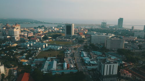 High angle view of illuminated city against clear sky