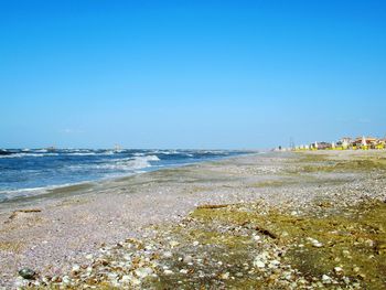 Scenic view of sea against clear blue sky