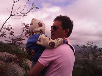 Woman with arms outstretched in background