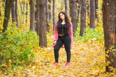 Full length portrait of a woman in forest