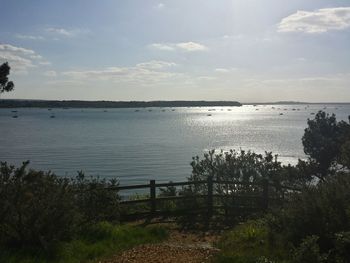 Scenic view of sea against cloudy sky