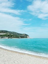 Scenic view of sea against blue sky