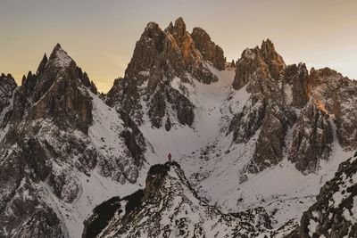 Scenic view of snowcapped mountains against sky during winter