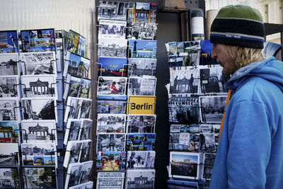 Rear view of man standing in market