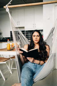 Young woman sitting in a room