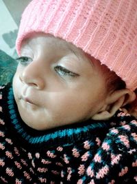 Close-up portrait of cute girl in hat