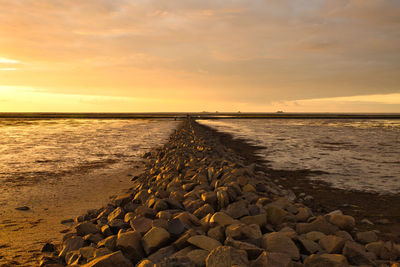 Scenic view of sea against sky during sunset