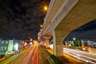 High angle view of light trails on road at night