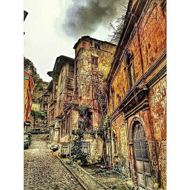 architecture, building exterior, built structure, sky, low angle view, auto post production filter, wall - building feature, door, old, transfer print, building, outdoors, cloud - sky, window, no people, day, history, closed, facade, church