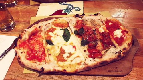 Close-up of pizza served on table