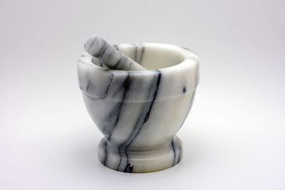 High angle view of ice cream on table against white background