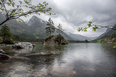 Scenic view of lake and mountains against sky