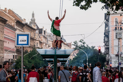 People at town square against sky