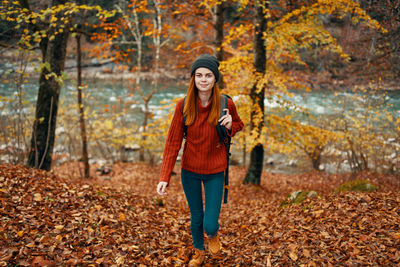 Portrait of woman in forest during winter