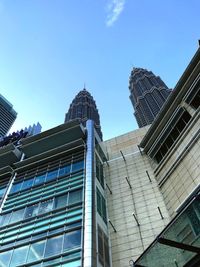 Low angle view of skyscrapers against clear sky