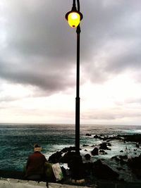 Scenic view of sea against cloudy sky