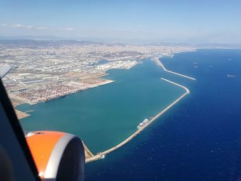 Aerial view of city by sea