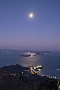 High angle view of sea against sky at night