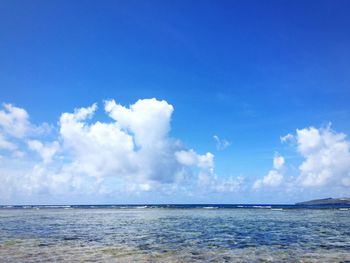 Scenic view of sea against cloudy sky