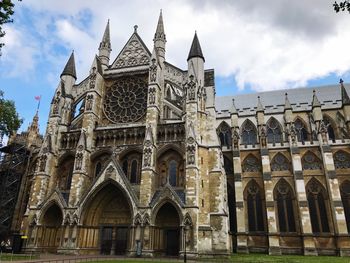 Low angle view of cathedral against cloudy sky