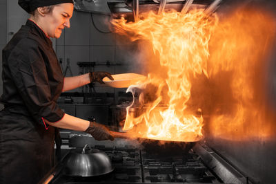 Midsection of man preparing food