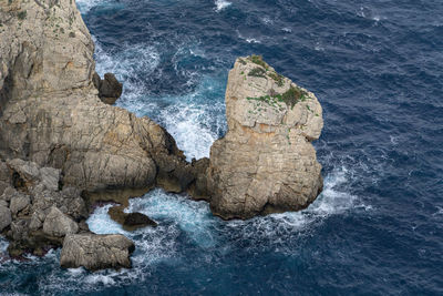 High angle view of rocks in sea