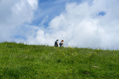 People on field against sky