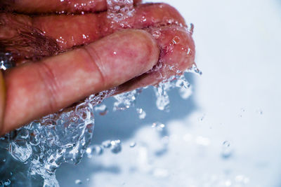 Close-up of hand holding ice cream