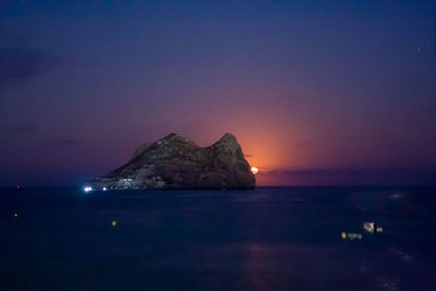 Scenic view of sea against sky at night