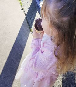 Rear view of girl and daughter outdoors