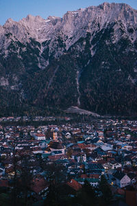 High angle view of townscape and mountains