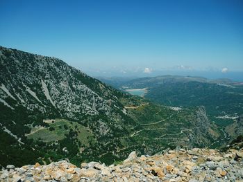 Scenic view of mountains against clear blue sky