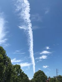 Low angle view of vapor trail against sky