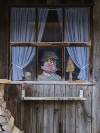 Clothes hanging on window of house