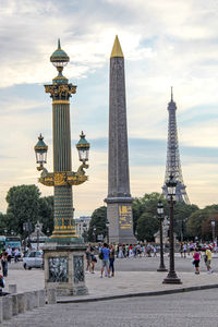 People at place de la concorde against sky