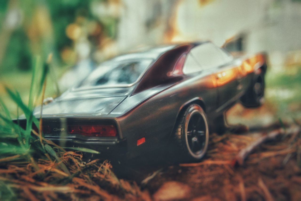 CLOSE-UP OF TOY CAR ON LAND