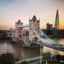 Tower bridge over thames river during sunset