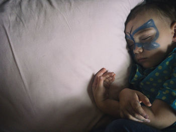 Rear view of people sleeping at home