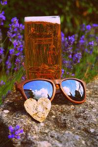 Close-up of sunglasses on glass wall