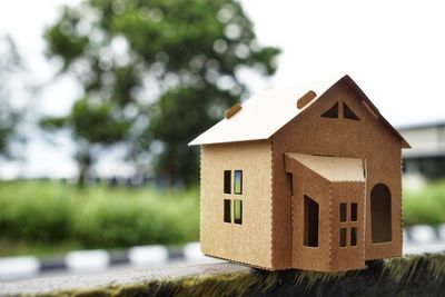 Close-up of birdhouse against building