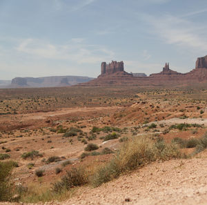 Scenic view of arid landscape against sky