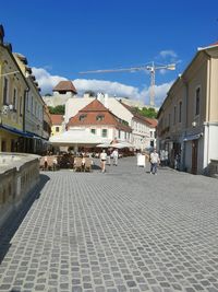 Houses in town against blue sky