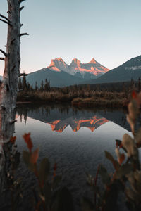 Scenic view of lake and mountains against sky in canmore, alberta, canada