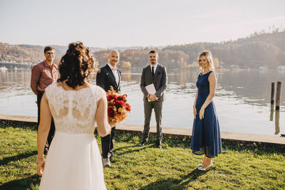Rear view of couple standing in park